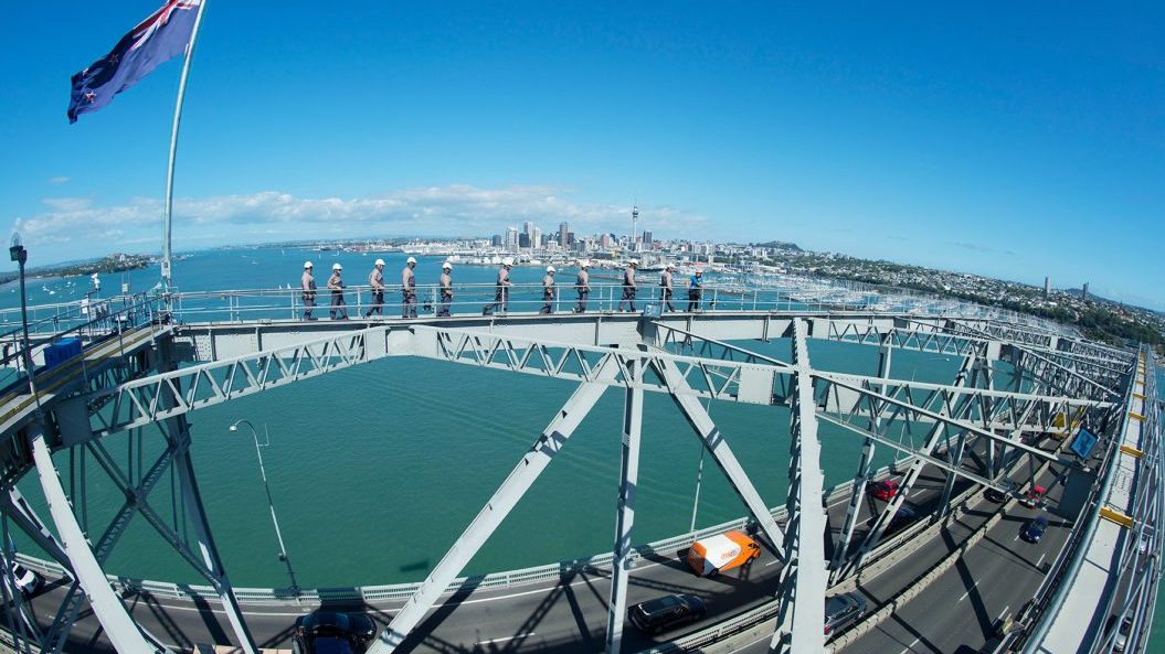 Group walking Auckland Harbour Bridge