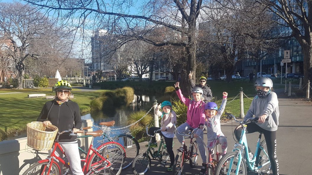 Family riding bikes in Christchurch city