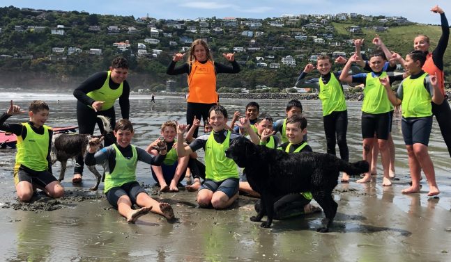 Young group learning to surf Christchurch