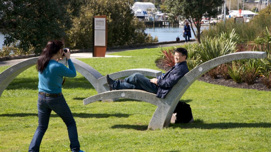 Whangarei sculpture and person taking a picture